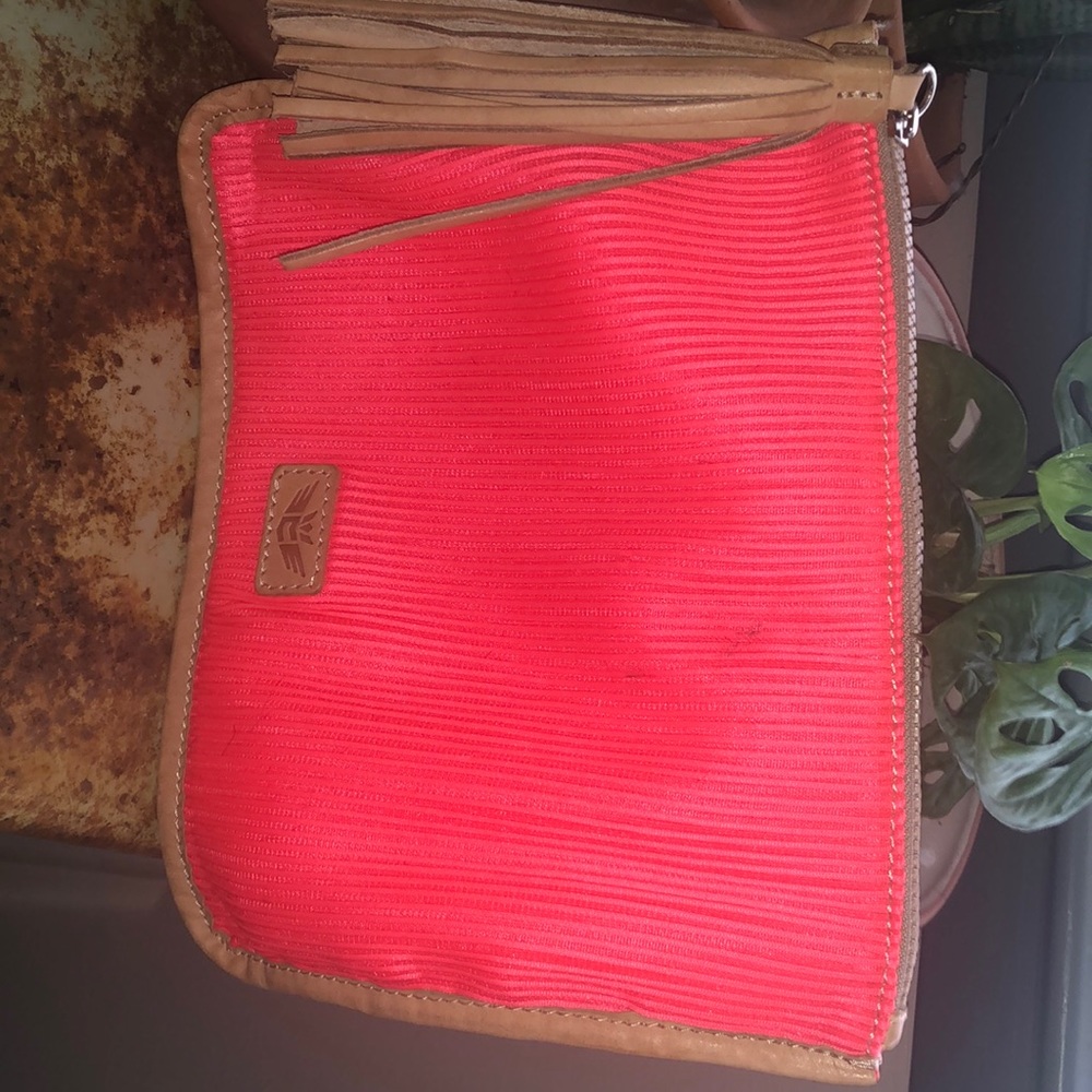 Consuela electric orange/coral mesh bag with zipper.